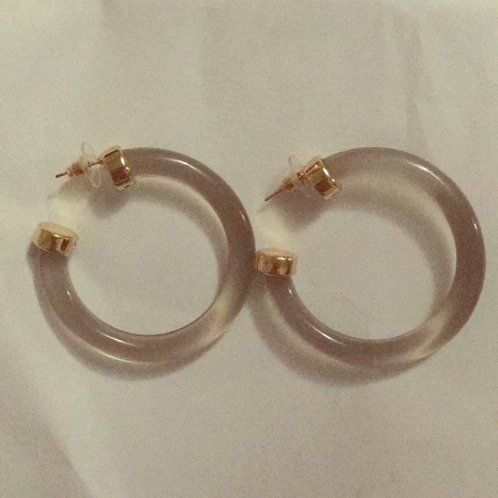 Gray lucite hoops with gold-plated end caps